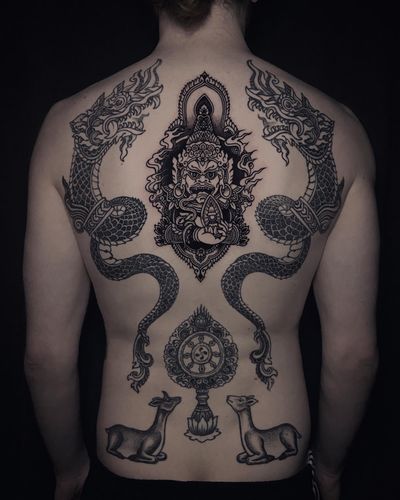 Request & Inquiry 👉 DM or 📧 ; Virupaksha, the finale of full back project for Hendrik. 🙏 Nāga dragons (8months), Dharmachakra & Deers (1year) healed. #customtattoo #virupaksha #naga #dragontattoo #thailand #tibetantattoo #dharmachakra #buddhisttattoo #tattooart #backtattoo #backpiece #tattoodesign #tattooideas #tätowierer #berlintattooers #berlintattooartist #tattooberlin #berlintattoo #tattoogermany #tätowierung #inked #blackwork #blackworkers #tattooworkers #tattoodo #tats #inkedmag #tattooshop #tattoolove #tattoovideo