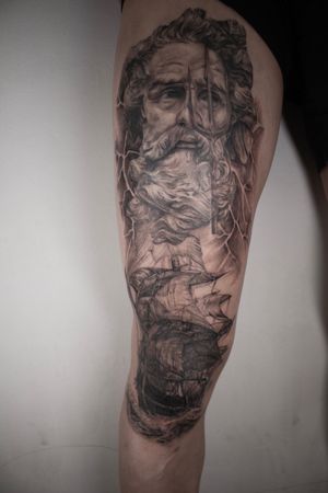 Black and grey leg tattoo. Poseidon and ship