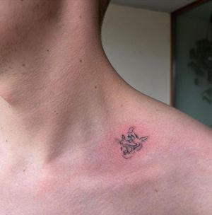 Beautiful illustrative flower tattoo on shoulder by Sofi. Delicate and intricate design.