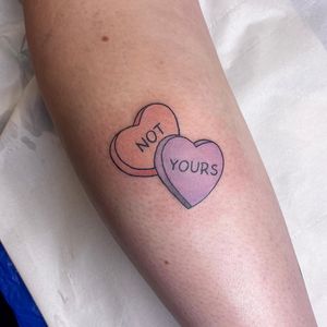 Small lettering quote with illustrative heart on forearm. Expertly crafted by renowned artist Rachel Angharad.