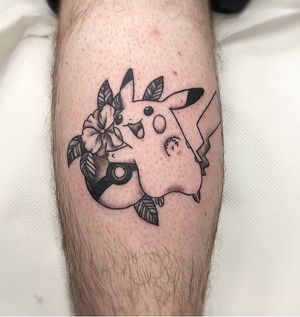 Unique lower leg tattoo by Rachel Angharad featuring a new school design with a Pikachu and pokeball motif.
