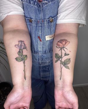 Beautiful flower design by Rachel Angharad on the forearm, a stunning illustrative piece.