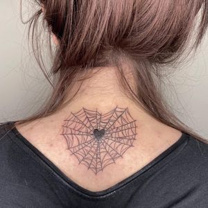 Intricately detailed fine-line spider and heart design with a delicate pattern and spider web by artist Rachel Angharad.