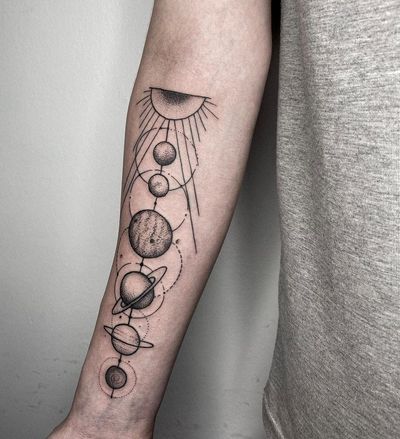 Get lost in the enchanting beauty of this blackwork moon and planet illustration on your forearm. By artist Nastya.