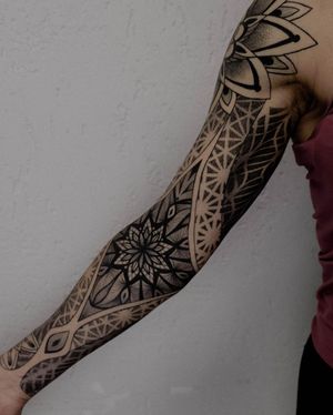 Enjoy a mesmerizing blackwork and dotwork pattern sleeve tattoo by Nastya, featuring ornamental and illustrative elements.