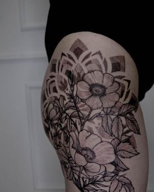 Beautiful blackwork and dotwork design on upper leg by tattoo artist Nastya.