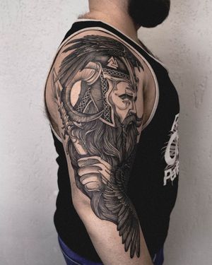 Impressive blackwork design featuring a viking warrior with a spear, adorned with a raven and horns. By artist Nastya.