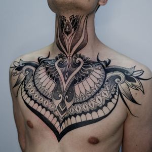 Elegant blackwork and dotwork design by Nastya featuring intricate patterns and mandala motif on the chest.