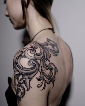 Elegant and intricate filigree design in blackwork style, beautifully crafted on the upper arm by talented artist Nastya.
