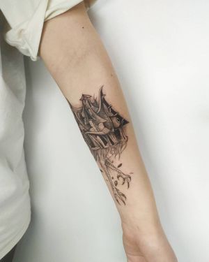 Unique blackwork forearm tattoo by Maryna featuring a house, eye, and claw in an illustrative style.