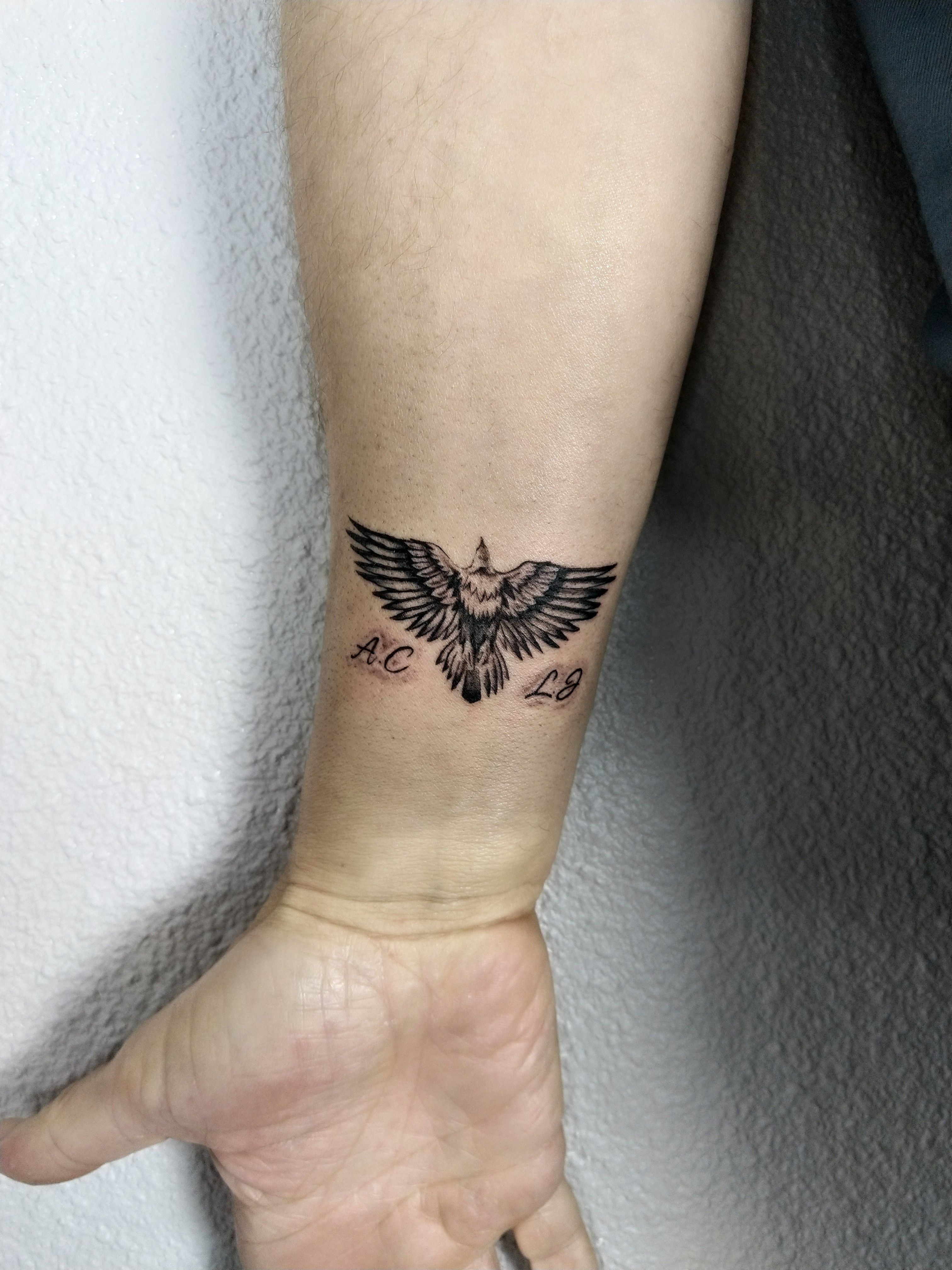 Micro-realistic eagle tattoo on the inner arm.