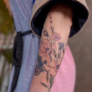 Adorn your forearm with a beautiful illustrative flower tattoo by the talented artist Liliia