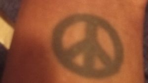 This was the first tattoo I got when I was 21 my little peace sign ☮️