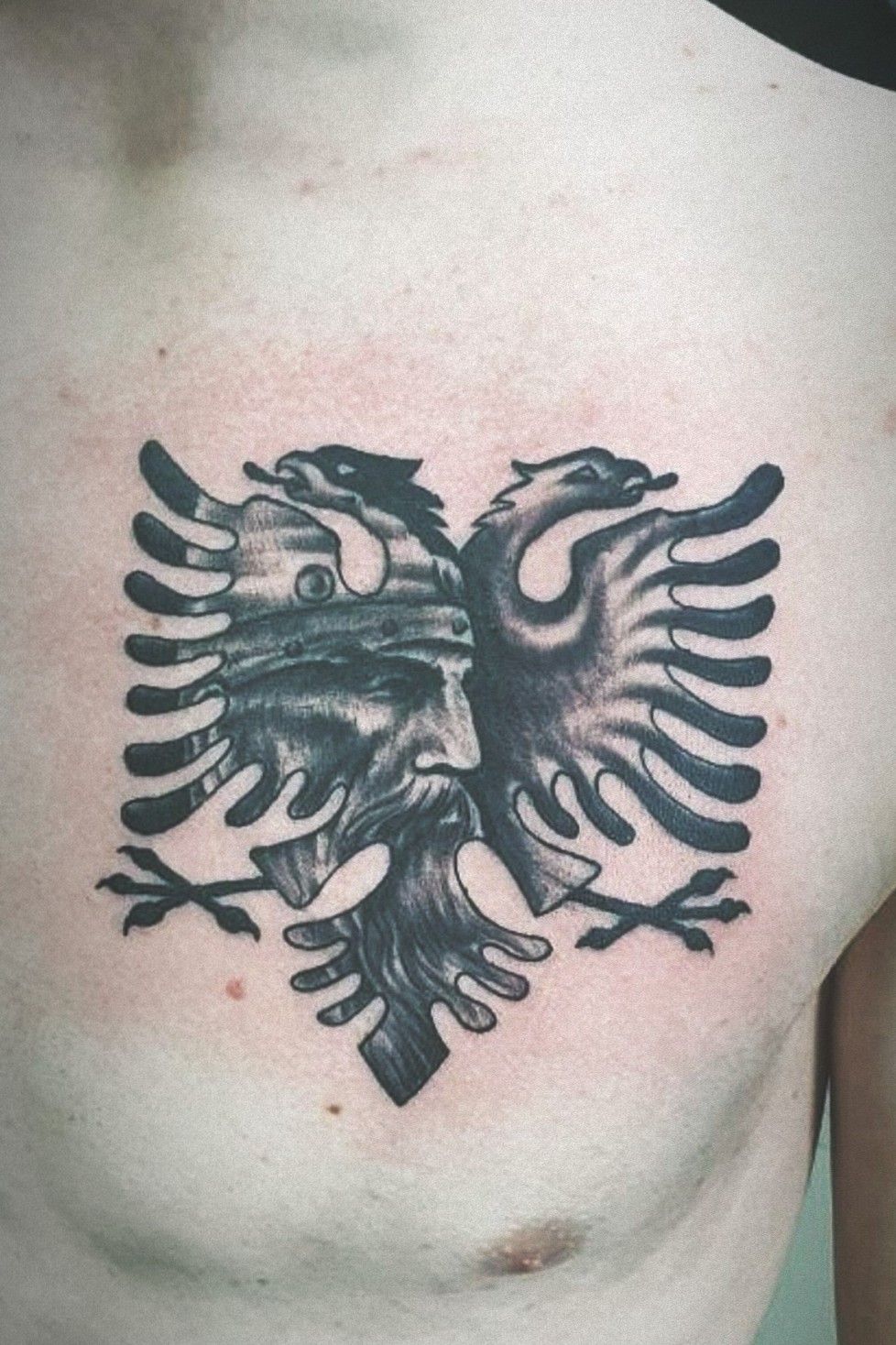Rob Corsino did this Albanian eagle with the American flag inside it last  night for Chris  By Black Cherry Tattoo Studios  Facebook