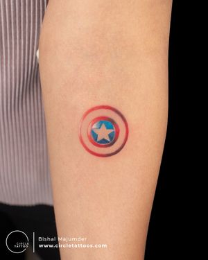 Colour Captain America Shield Tattoo done by Bishal Majumder at Circle Tattoo Studio