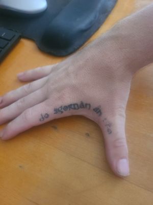 Scottish Gaelic language in Hobbit font-Do Sgornan an seo; translation- your throat here. Had 1 touch up so far and still need more to fix the tattoo 