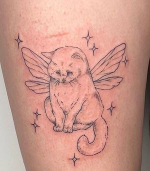 This is a reference photo for type of tattoo I want. I would like an angel kitten on my left hand drinking a glass of wine, smiling down at a smaller kitty without wings. 