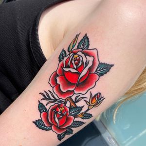Elegant traditional rose tattoo created by talented artist Flashbyaj, featuring vibrant colors and intricate details.