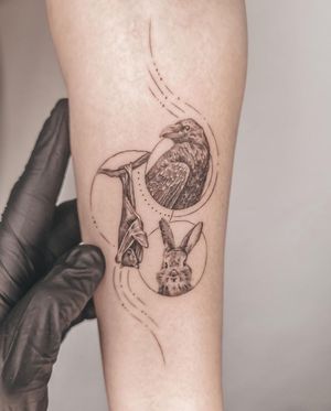 Exquisite forearm tattoo by George Francis featuring a bat, rabbit, bird, and intricate patterns in fine line illustrative style.