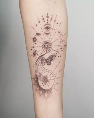 Fine line illustration by George Francis on forearm featuring a planet, butterfly, pattern, and eye motifs.