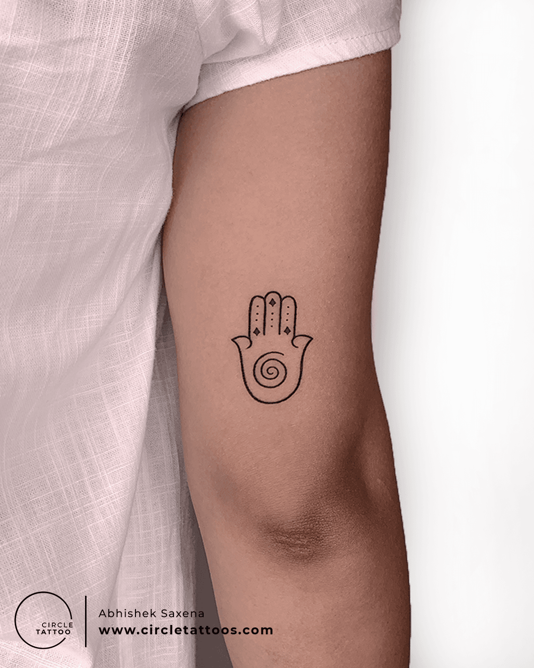 Hamsa tattoo located on the inner forearm.