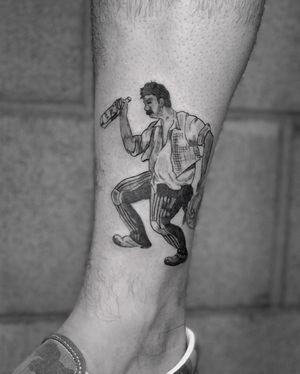 Get inked with a mesmerizing blackwork tattoo by Angel Chavez, featuring a man and a bottle in an illustrative style.