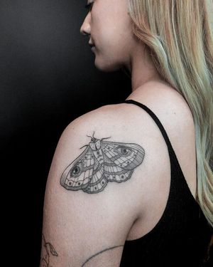 Get a stunning upper back tattoo featuring intricate butterfly and moth designs by Alisa Hotlib. Embrace your inner transformation!