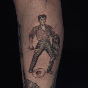 Stunning lower leg tattoo by Angel Chavez featuring a detailed blackwork illustration of a man wearing a hat.