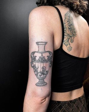 Stunning blackwork vase with intricate filigree design by Alisa Hotlib, perfect for upper arm placement.