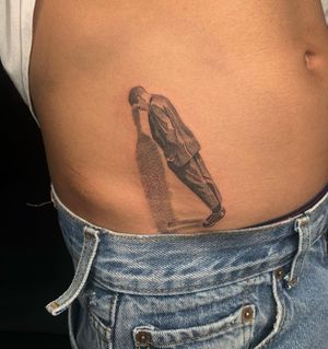 Unique blackwork tattoo of a man on stomach, beautifully done by Angel Chavez.