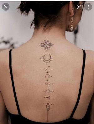 Something like this except with the sun and moon together in the center with different star constellations going up and down the spine with some water color in the background to look like a galaxy 