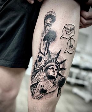 Blackwork tattoo on upper leg by Ruslan, featuring small lettering and emoji with an illustrative statue motif.