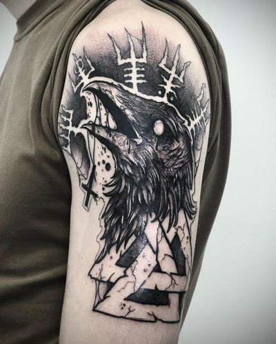 Impressive blackwork piece by Ruslan featuring a majestic raven perched on a cross, beautifully illustrated.