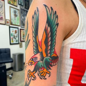 Get a stunning illustrative eagle tattoo on your upper arm by the talented artist Nick Osbourn. Embrace the power and beauty of this timeless motif.