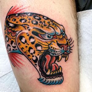 Embrace the fierce beauty of a neo-traditional leopard tattoo on your upper arm. Expertly crafted by Jason Fancher, this illustrative design is a bold statement of strength and style.
