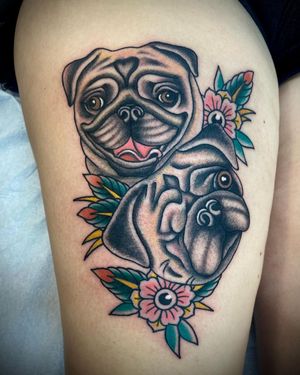 Unique and bold upper leg tattoo featuring a traditional style dog and flower design, expertly done by Sasha Ignarski.