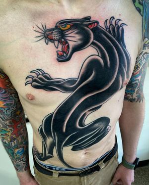 Showcase your fierce side with this illustrative panther tattoo by Philip LaRocca. Perfect for chest placement.