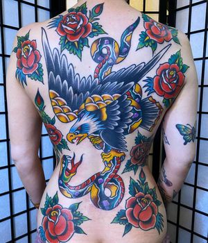 Masterpiece by Philip LaRocca featuring a traditional design with a snake, eagle, and flower motif.