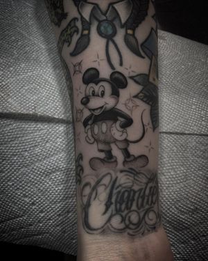 Philip LaRocca's unique design combines mickey, lettering, and illustrative elements for a personalized tattoo on your forearm.