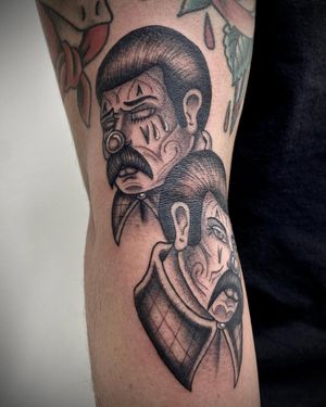 Check out this black and gray tattoo of a man with clown makeup and tears, done by Sasha Ignarski on the arm.