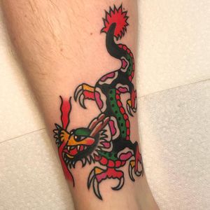 Get inked with a fierce and detailed Japanese dragon design on your lower leg, expertly done by Nick Osbourn.
