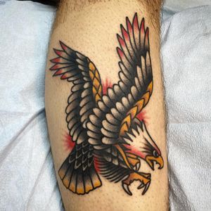 Get a bold and timeless illustrative eagle tattoo on your lower leg by renowned artist Philip LaRocca.