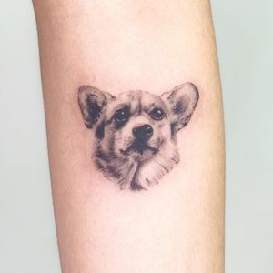 Capture the loyalty and love of your furry friend with a stunning realistic dog tattoo on your forearm. Expertly done by Juliany Braga.