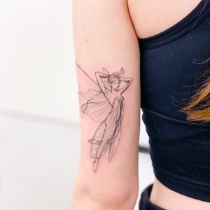 Graceful fairy woman with intricate wings, beautifully detailed in blackwork by Juliany Braga on upper arm.
