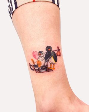 Get inked with this cute illustrative penguin tattoo by Juliany Braga, perfect for your lower leg.