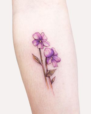 Beautifully detailed flower design by Juliany Braga on the forearm, perfect for a bold and artistic statement.