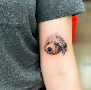 Get a stunning illustrative tattoo of your beloved dog by the talented artist Juliany Braga. The detailed and lifelike design will surely make a statement.