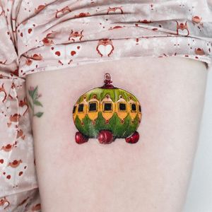 Get a stunning car tattoo by Juliany Braga on your upper arm. This illustrative design will bring your favorite car to life in a realistic style.