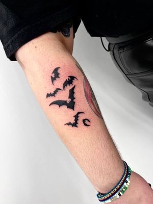 Get inked with a striking blackwork bat design by the talented Miss Vampira on your forearm. A unique and bold choice for tattoo enthusiasts.