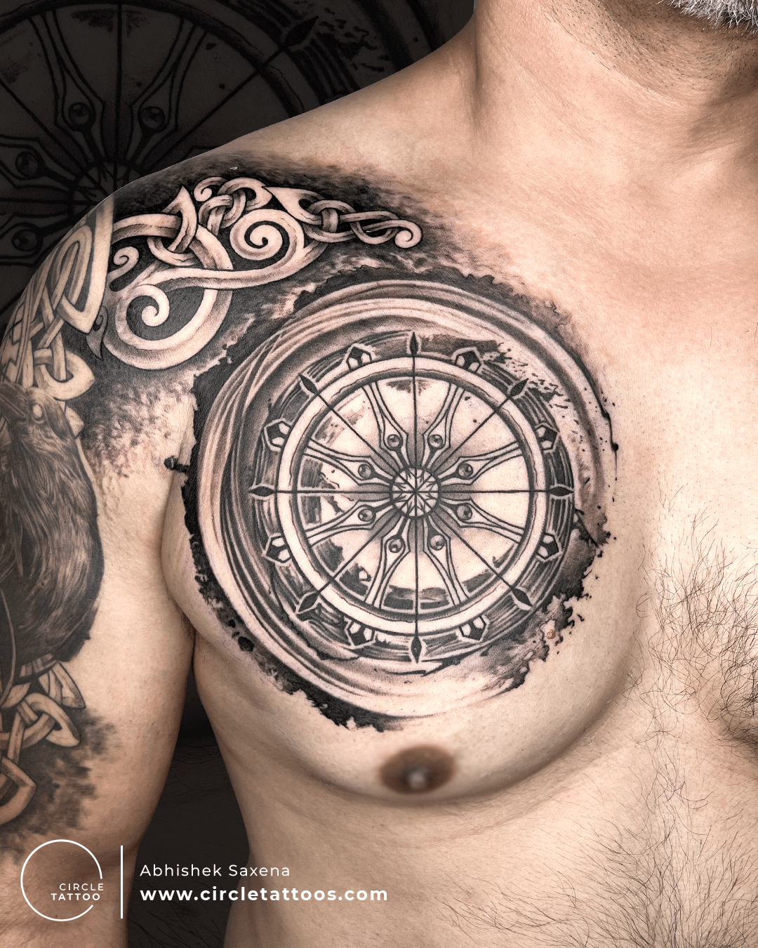 Dharma Wheel Forearm Tattoo with Endless Knots